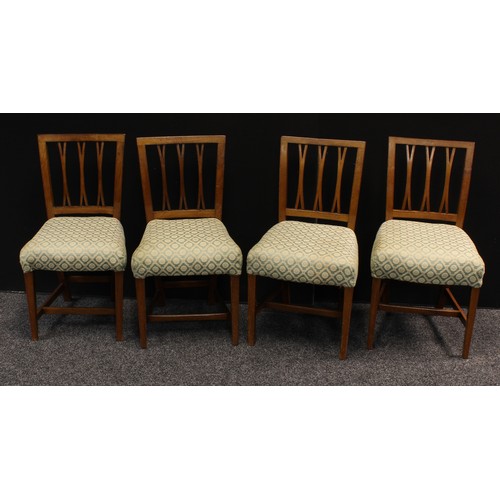 143 - A set of four mahogany dining chairs, stuffed over upholstery, H-stretchers; another set of four oak... 