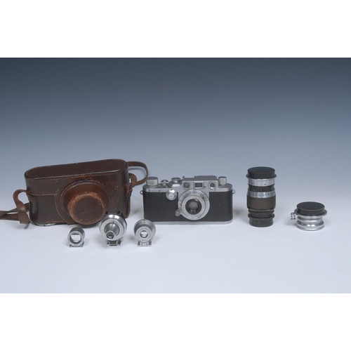 1830 - A Ernst Leitz Wetzlar Leica IIIc camera,serial number 508321, Elmar f3.5 50mm lens, leather case; a ... 