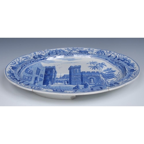 54 - A Spode Caramanian Series oval meat plate, with well,  transfer printed in in tones of blue with The... 