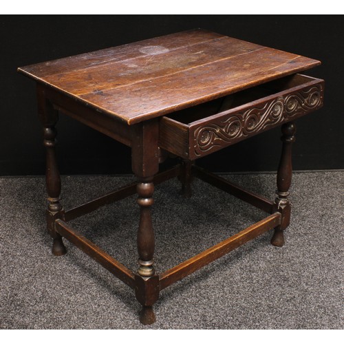 206 - A 17th century oak side table, oversailing rectangular top above one long carved drawer, shaped apro... 