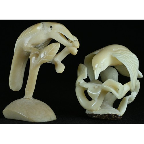 5109 - A Colonial vegetable ivory carving, of a bird, 6.5cm long; another, similar (2)