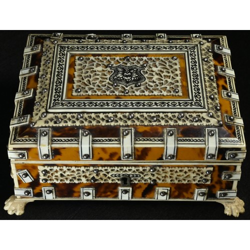 5309 - An Indian tortoiseshell and Vizagapatam rectangular sarcophagus box, hinged cover, lion paw feet, 12... 