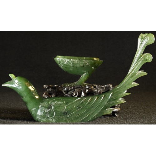 5102 - A Chinese spinach jade box and cover, carved as a bird, hardwood stand, 12cm high