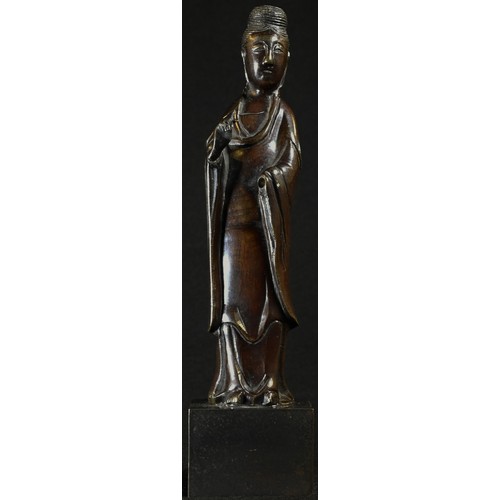 5335 - Chinese School, a brown patinated bronze, Guanyin, rectangular base, 19cm high