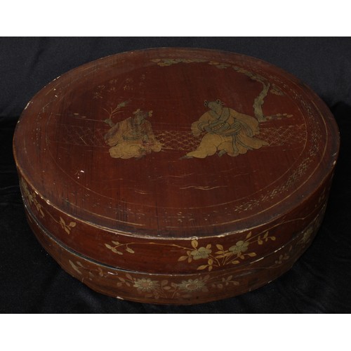 5092 - A Chinese lacquer circular box and cover, decorated in gilt with figures before trellis, 31cm diam, ... 