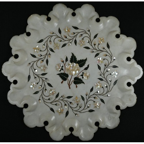 5299 - An Indian alabaster shaped circular table-top, inlaid in mother-of-pearl and coloured specimen stone... 