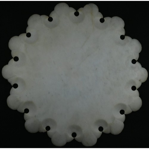 5299 - An Indian alabaster shaped circular table-top, inlaid in mother-of-pearl and coloured specimen stone... 