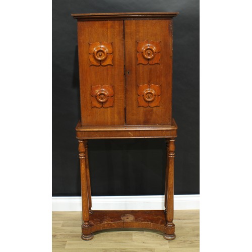 5321 - An unusual William IV oak portable cabinet on stand, moulded cornice above a pair of rectangular doo... 