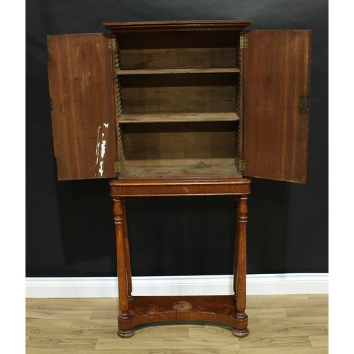 5321 - An unusual William IV oak portable cabinet on stand, moulded cornice above a pair of rectangular doo... 