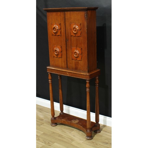 5321 - An unusual William IV oak portable cabinet on stand, moulded cornice above a pair of rectangular doo... 