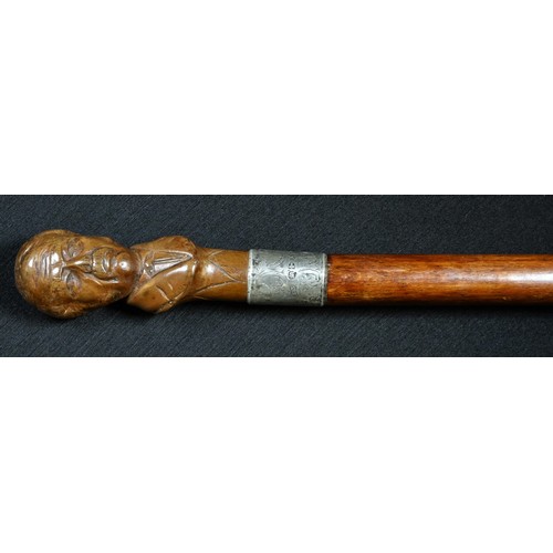 5117 - A gentleman's novelty walking cane, the pommel carved as a portrait bust of David Lloyd George, silv... 