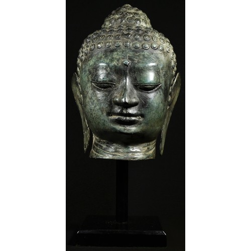 5098 - A Chinese sculpture, after an ancient bronze, head of Buddha, square plinth, 41cm high