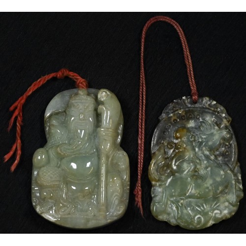 5088 - A Chinese hardstone pendant, carved as an immortal holding a staff, 5.5cm x 4cm; another, similar (2... 