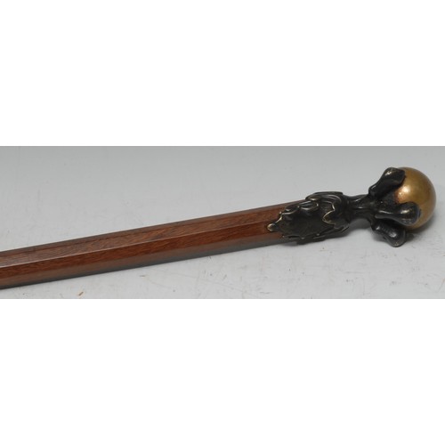 5076 - A bronze mounted gentleman's walking stick, as an eagle's claw grasping a ball, tapered octagonal ca... 