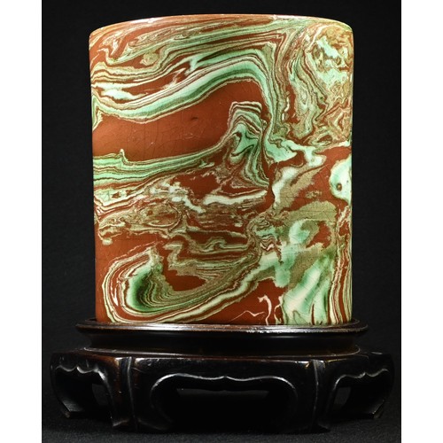 5084 - A Chinese earthenware bitong brush pot, the marbled glaze in tones of green and brown, 13.5cm high, ... 