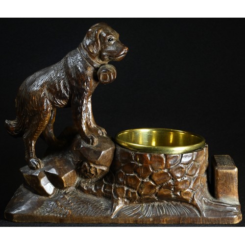 5071 - A Black Forest novelty table vesta, carved with a St Bernard dog, with provision for match box and b... 