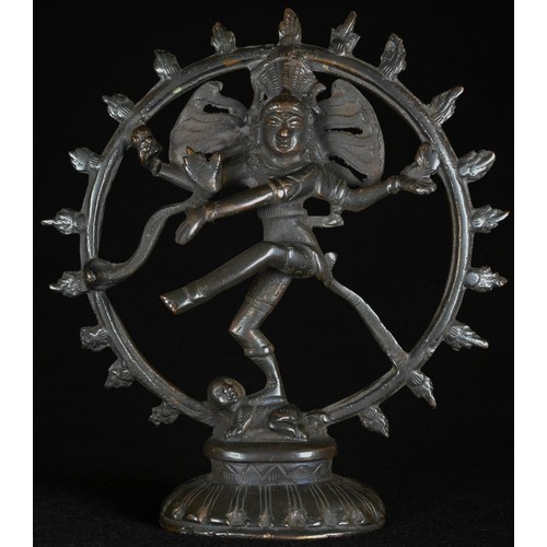 5304 - An Indian dark patinated copper alloy shrine figure, cast as Shiva Nataraja, within a jvala mala, lo... 