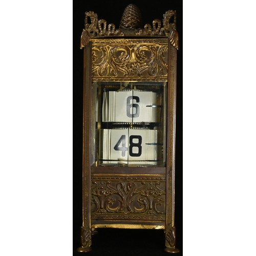 5112 - A French gilt metal flip ticket clock, embossed in the Neo-Classical taste with scrolling acanthus a... 