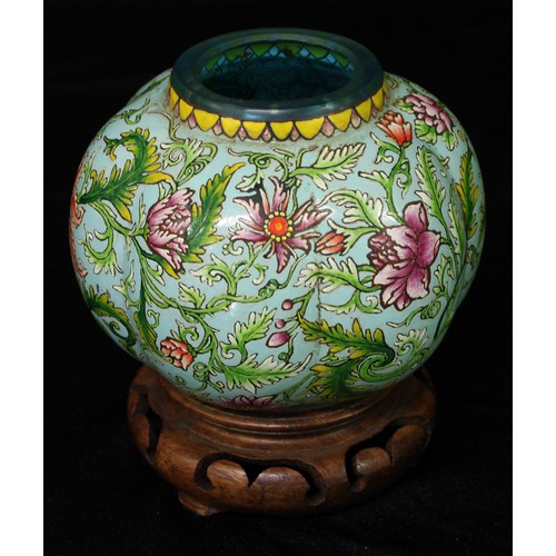 5097 - A Chinese Peking glass lobed ovoid water pot, brightly decorated with scrolling flowers on a turquoi... 