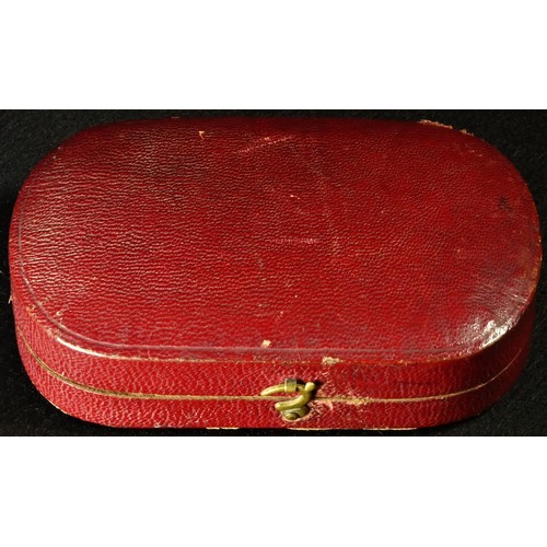 5065 - A 19th century wax portrait, of a gentleman, bust length, 5.5cm x 3.5cm, red morocco travelling case