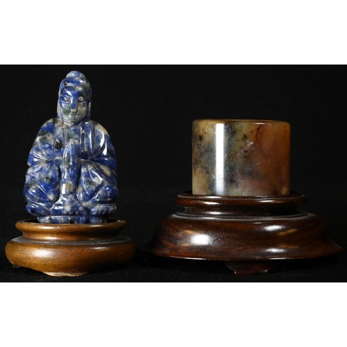 5093 - A Chinese lapis lazuli carving, of Buddha, 5.5cm high, hardwood stand; a Chinese russet jade archer’... 