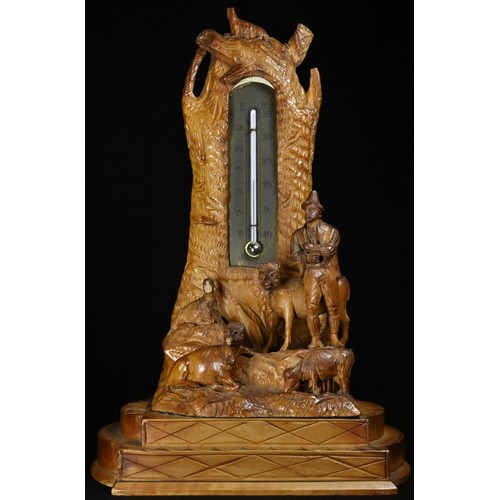 5073 - A Black Forest table top thermometer, carved with a Tyrolean shepherd and his flock, 24cm high, c.19... 