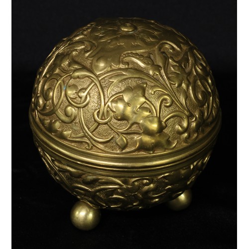 5288 - An early 20th century gilt metal globular string box, cast in relief with scrolling leafy strapwork,... 