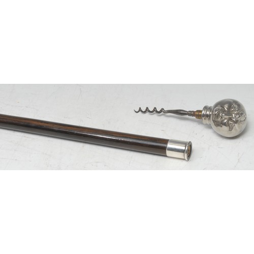 5115 - A gentleman's novelty walking cane, enclosing a corkscrew, the comical silver plated pommel as a fac... 