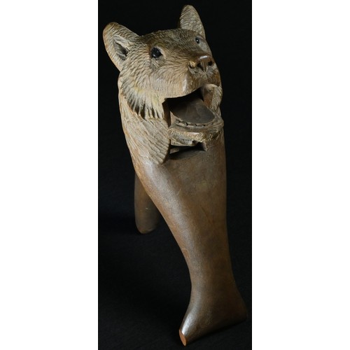 5069 - A Black Forest novelty lever-action nut cracker, carved as the head of a bear, 16cm long, c.1900