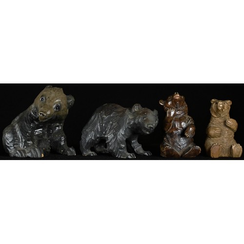 5067 - A Black Forest carving, of a bear cub, seated, 7cm high, early 20th century; others (4)