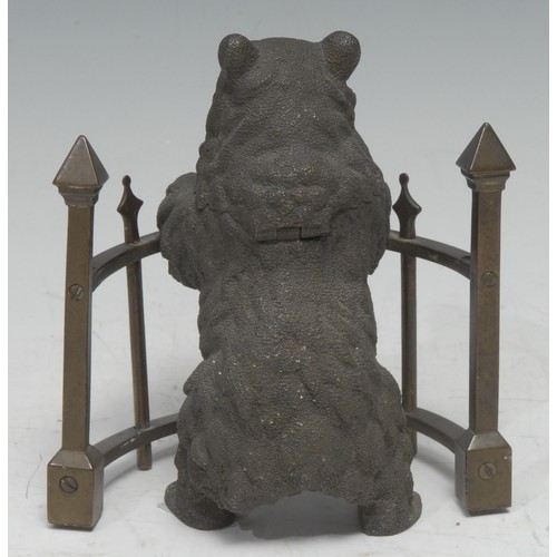 5059 - A 19th century Russian brown patinated bronze novelty inkwell, as a bear standing at railings, his h... 