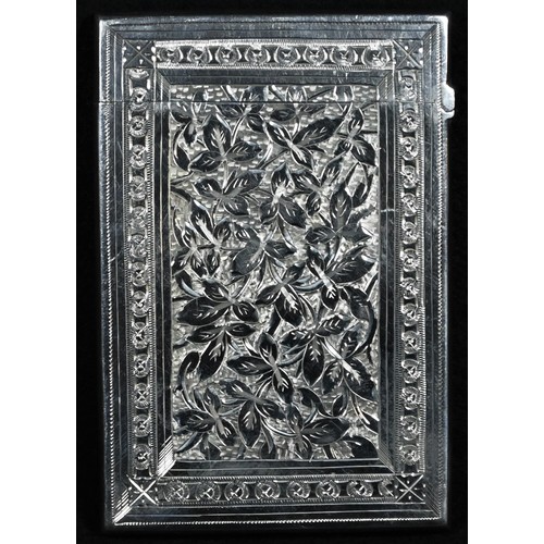 305 - A Victorian silver rectangular visiting card case, bright-cut engraved with scrolling leaves centred... 