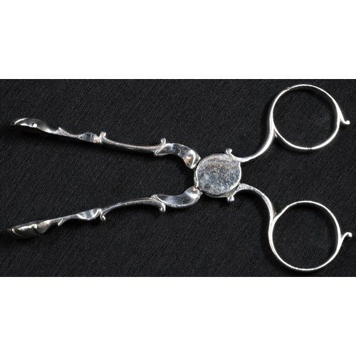 308 - A pair of George II silver sugar tongs, shell bowls, circular box pivot, 11.5cm long, maker JA in sc... 