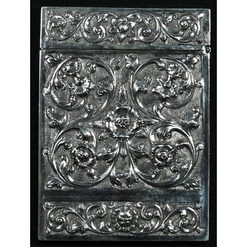 310 - An Indian silver rectangular visiting card case, chased with flowers and scrolling leaves, on a text... 