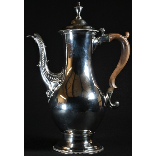 319 - A George III silver baluster coffee pot, urnular finial, hinged domed cover, acanthus-capped spout, ... 