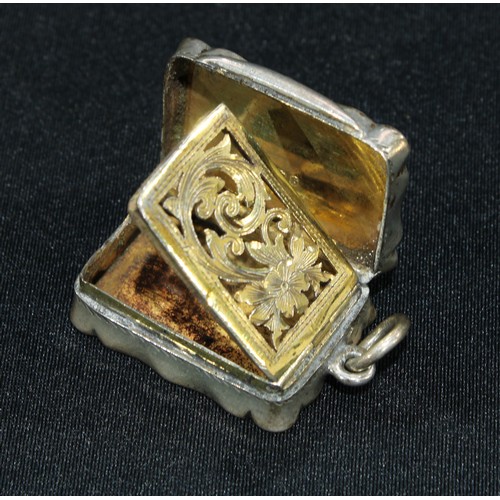 337 - A Victorian shaped rectangular silver vinaigrette, the hinged cover enclosing a gilt interior with p... 