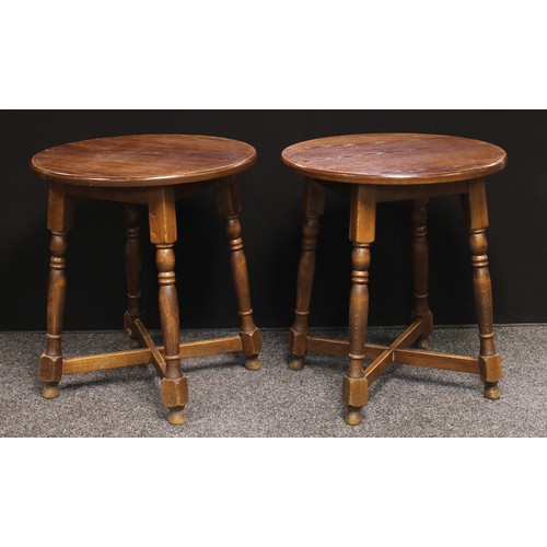 219 - A pair of 20th century oak pub tables, circular tops, turned legs, X-stretcher, 73cm high, 67cm diam... 