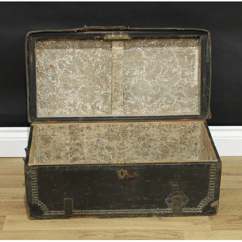 344 - An 18th century brass bound leather travelling trunk, hinged cover, studded borders, 27cm high, 62cm... 