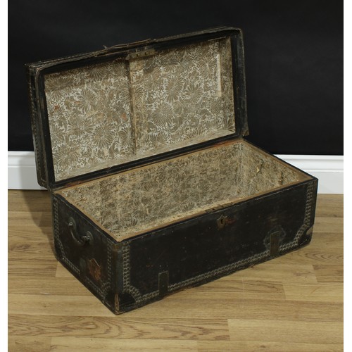 344 - An 18th century brass bound leather travelling trunk, hinged cover, studded borders, 27cm high, 62cm... 