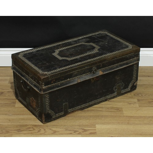 344 - An 18th century brass bound leather travelling trunk, hinged cover, studded borders, 27cm high, 62cm... 