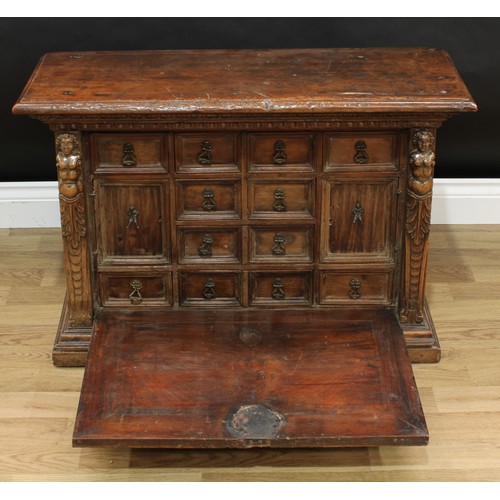 346 - An 18th century Italian walnut table cabinet, oversailing top above a fall front enclosing cupboards... 