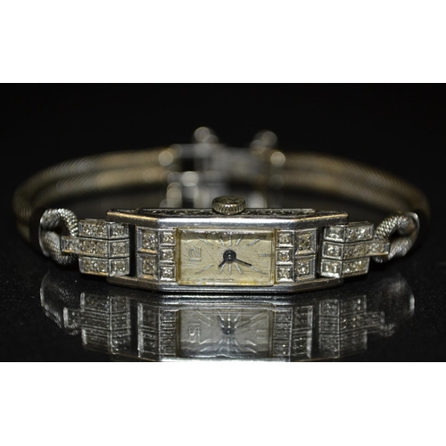 3029 - An Art Deco lady's platinum and diamond cocktail watch, rectangular case, inset to each end with fiv... 