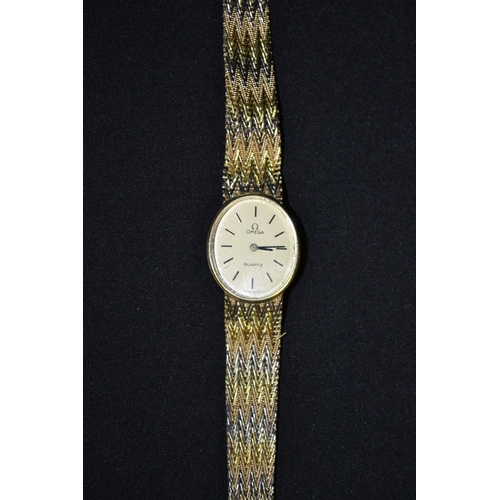 3031 - Omega - a Lady's bracelet watch, oval cream dial, baton markers, quartz movement, fancy 18ct three c... 