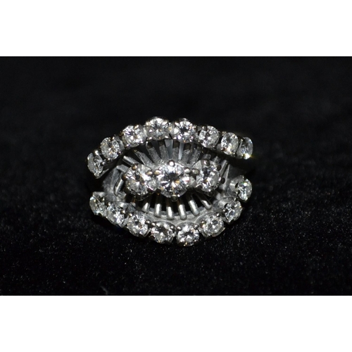 3108 - A nineteen stone diamond cluster ring, central row of three round brilliant cut diamonds, flanked to... 