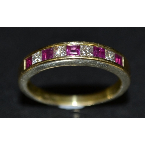 3121 - A ruby and diamond half eternity ring, linear set with five princess cut square ruby's and four conf... 