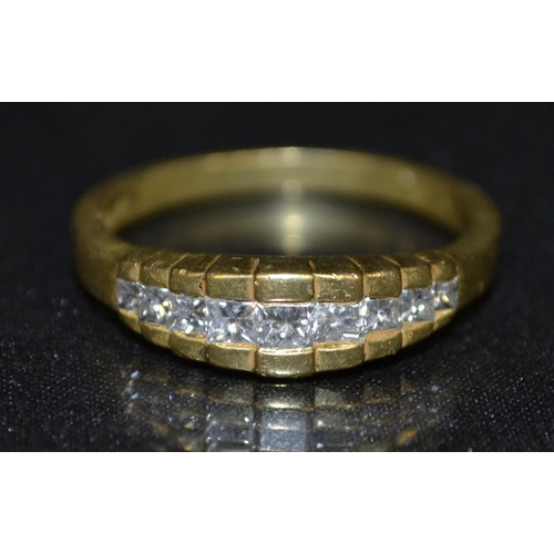 3127 - A diamond half eternity ring, nine graduated princess cut diamonds, arranged in a linear stepped row... 