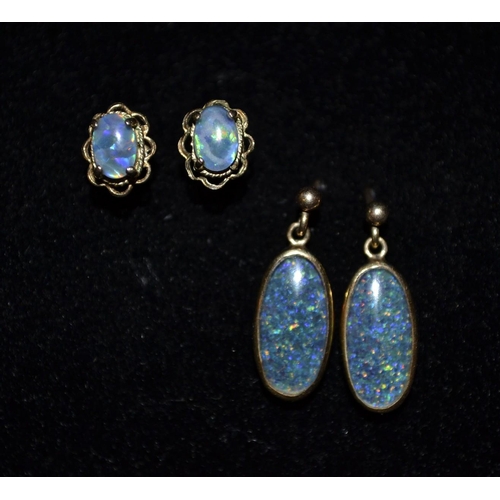 3188 - A pair of black opal oval droplet earrings, each flashing, red, amber, blue and green colour play, 9... 