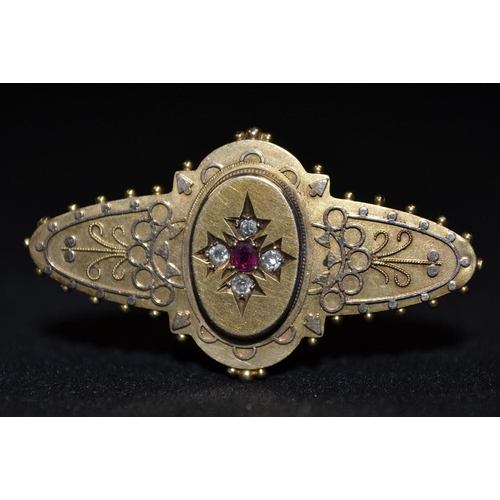 3247 - A late Victorian Aesthetic Movement diamond and ruby brooch, central ruby, surrounded by four round ... 