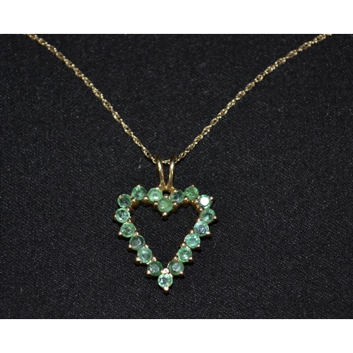 3249 - An emerald heart pendant necklace, open heart pendant encrusted with eighteen small round emeralds, ... 