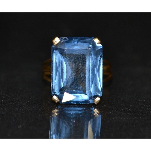 3252 - An Art Deco dress ring, large octagonal blue topaz set within an ornate foliate basket claw, 18ct go... 